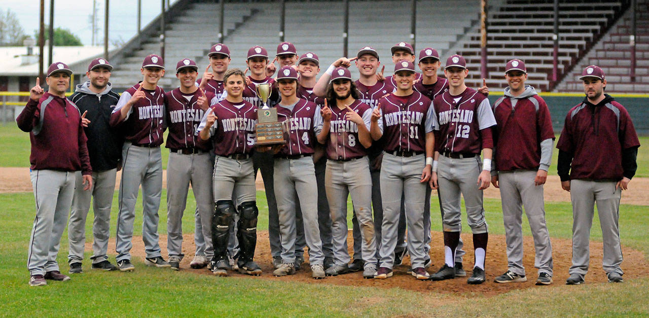The Montesano Bulldogs pose for a photo after winning the 1A District IV championship with a 6-0 win over Hoquiam on Saturday at Olympic Stadium in Hoquiam. (Ryan Sparks | Grays Harbor News Group)