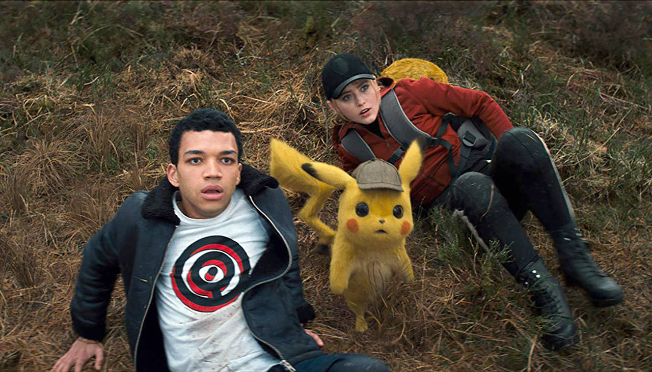 Warner Bros. Pictures                                Justice Smith and Kathryn Newton with Pikachu in “Pokemon: Detective Pikachu.”