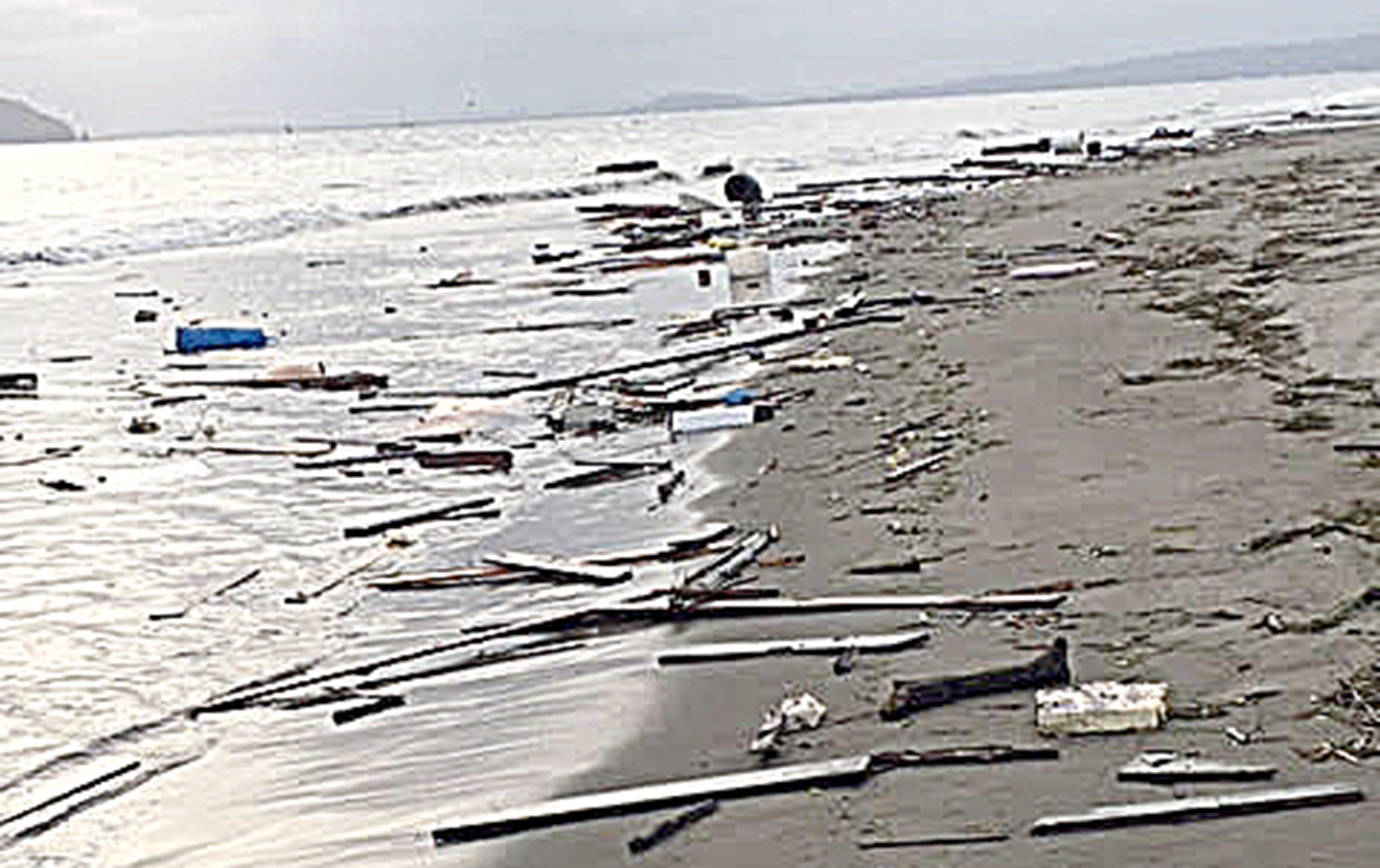 courtesy U.S. Coast Guard Sector Columbia River Incident Management Division                                Debris from the 38-foot commercial fishing vessel Theron wash up on a beach along the northern side of Clatsop Spit, Oregon, May 13. The Theron grounded on the spit earlier that morning after the vessel master lost steering while attempting to cross the Columbia River Bar.