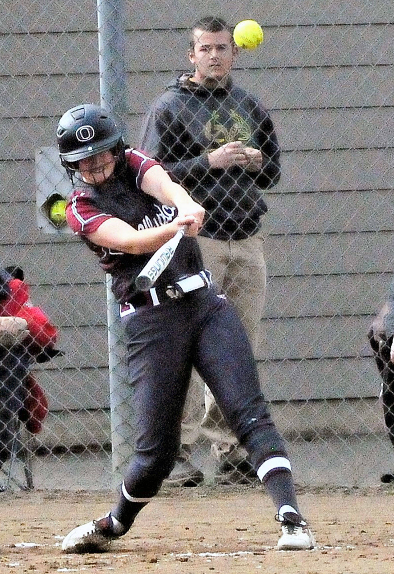 Ocosta infielder Kaylee Barnum hits one of her two home runs against Winlock on Friday at the 2B District IV Tournament in Centralia. Barnum had four hits to lead the Wildcats to a 13-7 victory in an elimination game. (Hasani Grayson | Grays Harbor News Group)