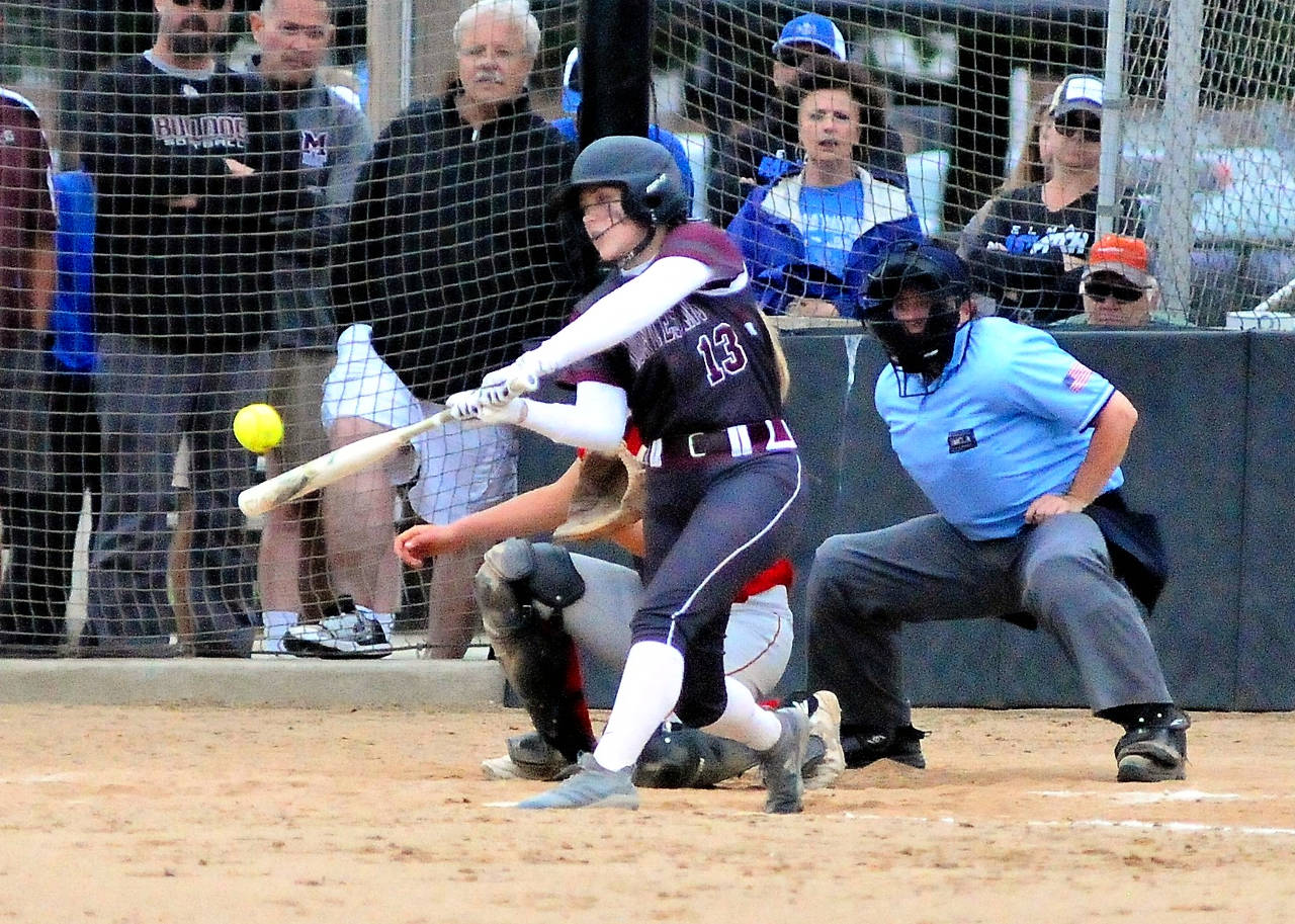 Montesano’s Janessa Otterstetter hits a deep drive in the seventh inning of the Bulldogs’ 4-1 loss to Castle Rock in the 1A District IV title game on Saturday in Centralia. (Hasani Grayson | Grays Harbor News Group)
