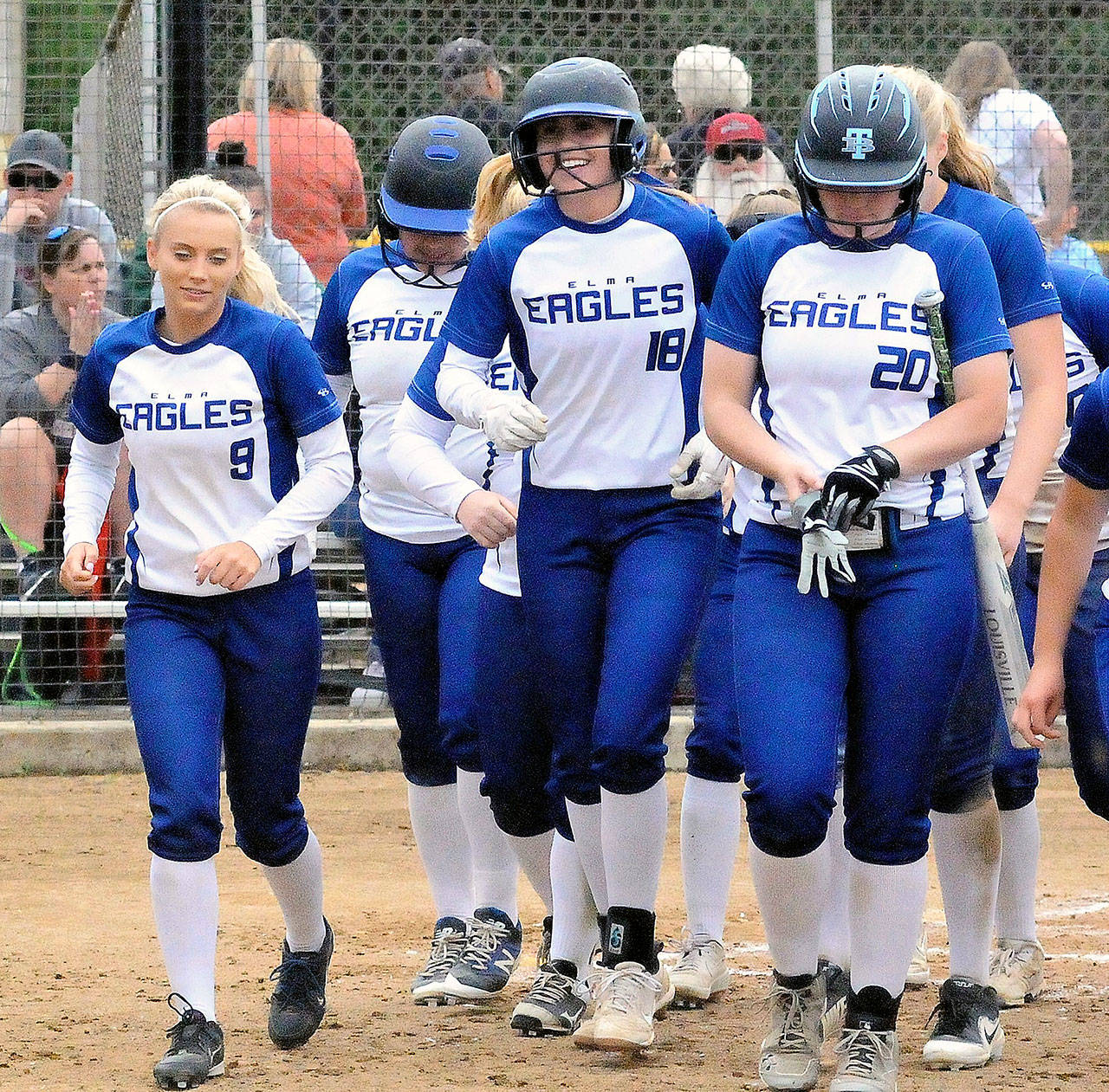 Elma’s Destry Dineen (18) walks back to the dugout with her teammates after hitting a home run on Saturday against Hoquiam. Dineen was named the 1A Evergreen League’s Offensive MVP the league announced Monday. (Hasani Grayson | Grays Harbor News Group)