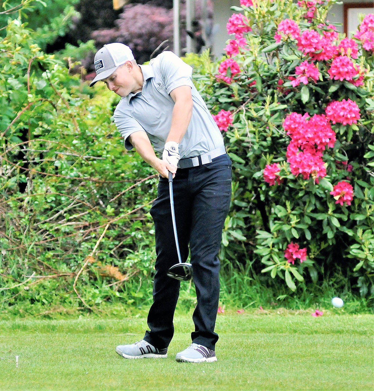 Montesano’s Payson Parker takes his tee shot from the 18th hole at Olympia Country and Golf Club during the 1A State Tournament on Thursday. Parker finished 11th with a score of 81 on day one of the tournament. (Hasani Grayson | Grays Harbor News Group)