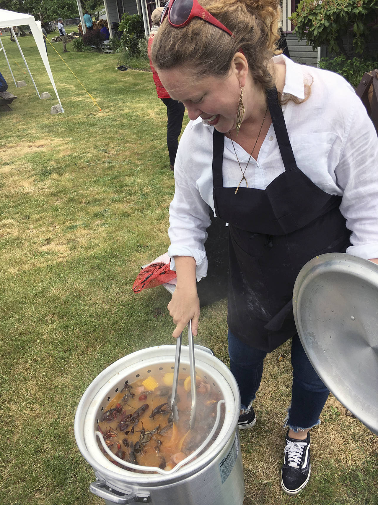Kat Bryant | Grays Harbor News Group                                Tokeland Hotel co-owner and chef Heather Earnhardt stirs a pot full of crawfish, new potatoes and corn.