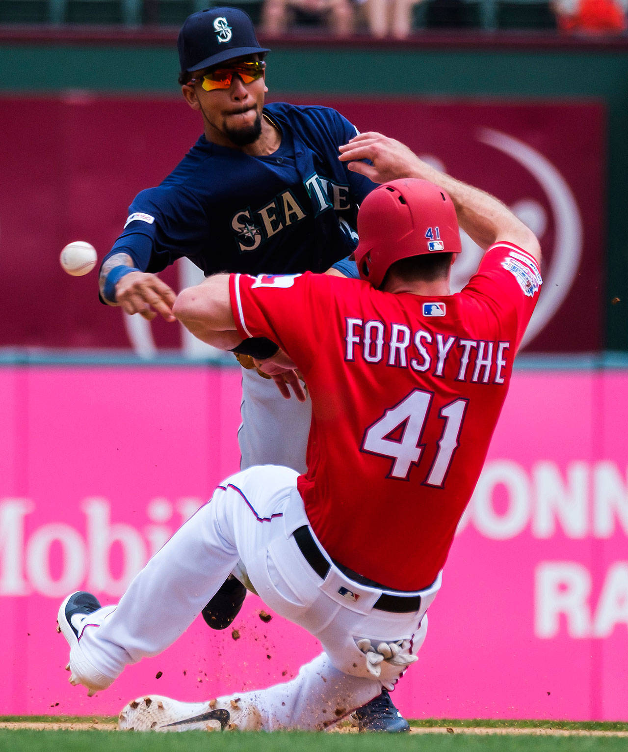 Seattle Mariners shortstop J.P. Crawford makes the relay over the Texas Rangers Logan Forsythe (41) as he is forced out at second base on the front end of a double play during the fourth inning on Wednesday, May 22. (Smiley N. Pool | Dallas Morning News/TNS)