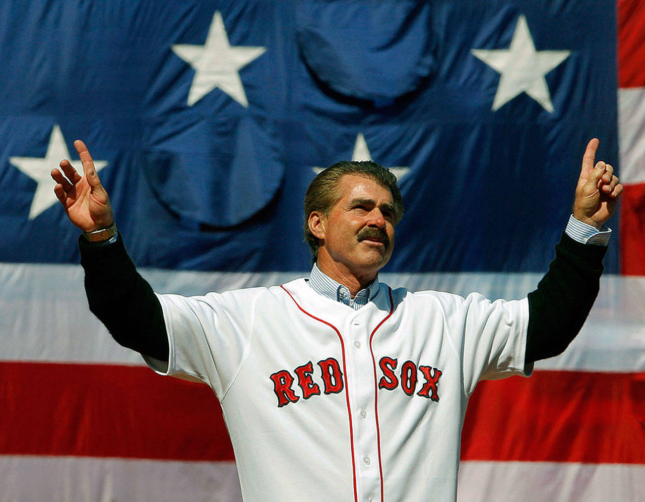 Former Boston Red Sox player Bill Buckner acknowledges the cheers from the crowd before throwing out the ceremonial first pitch at the MLB baseball game between the Boston Red Sox and Detroit Tigers on April 8, 2008 at Fenway Park in Boston, Massachusetts. Buckner passed away on Monday at the age of 69. (Brian Snyder-Pool | Getty Images/TNS)