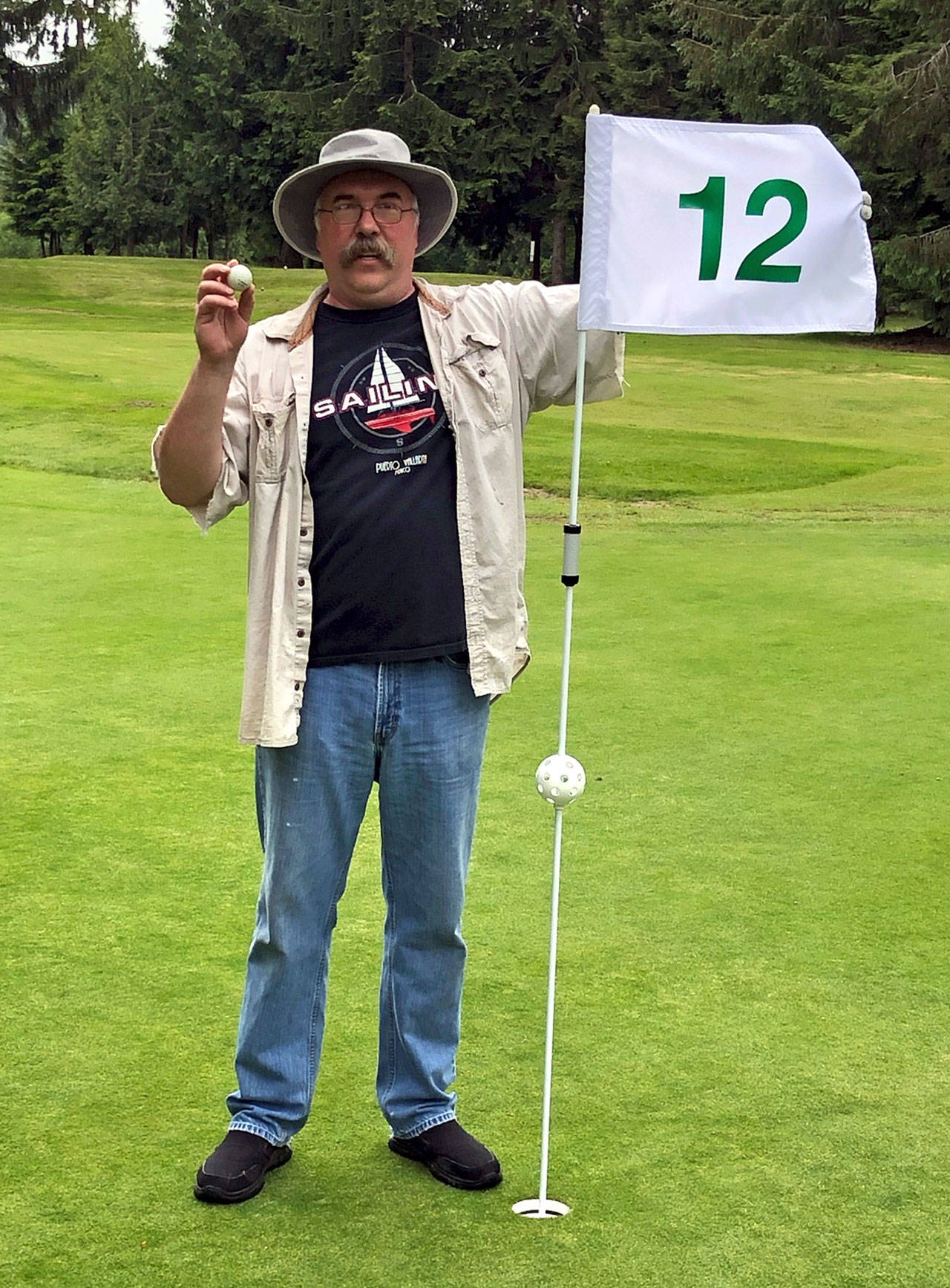 Eric Rydman poses for a photos after shooting an ace on the 12th hole on Thursday at Highland Golf Course. Rydman used a 9-iron to make the 120-yard shot. (Submitted photo)