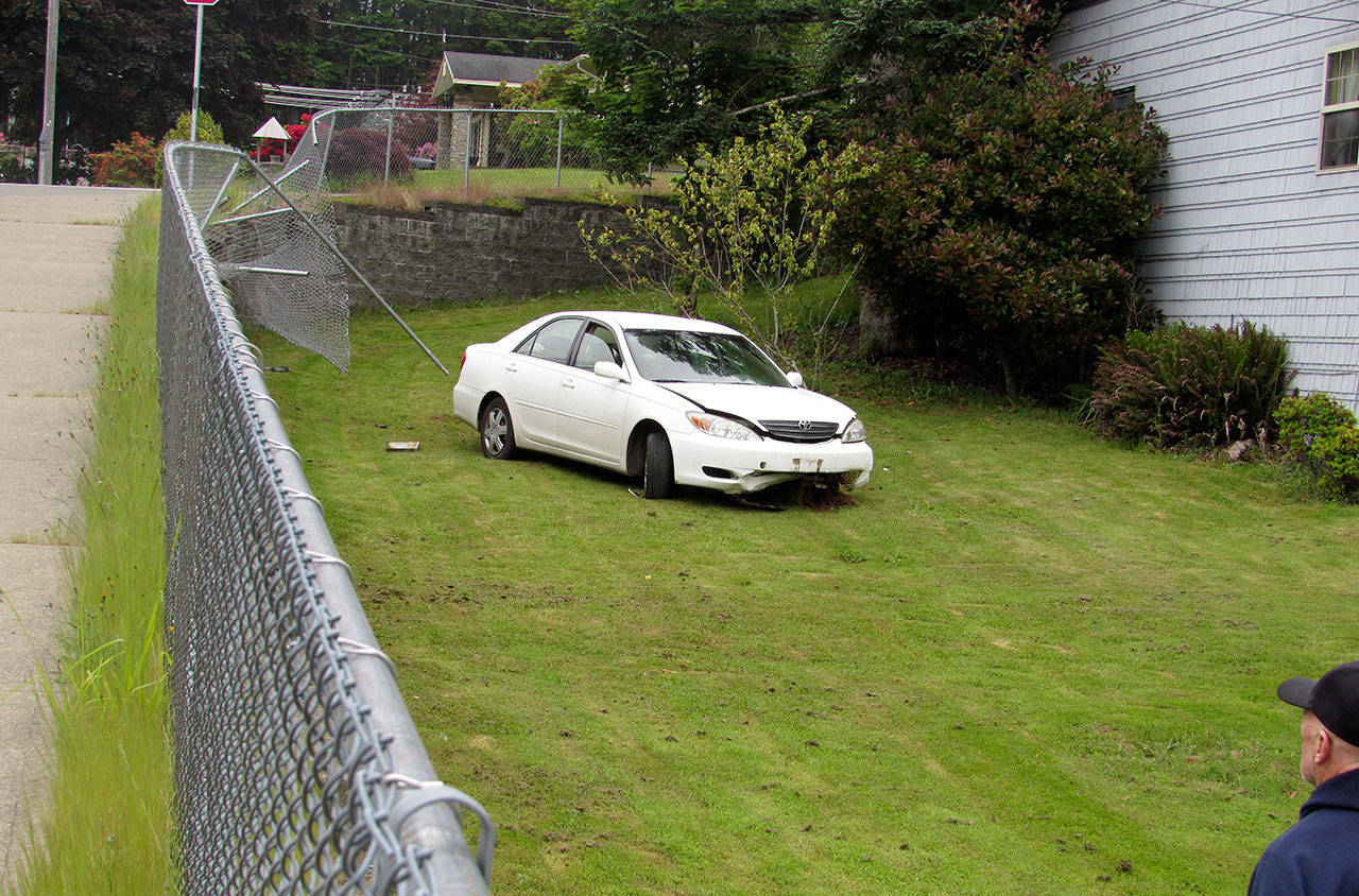 (Courtesy Ron Merila) A car crashed through a fence and off an embankment Friday morning in Central Park.