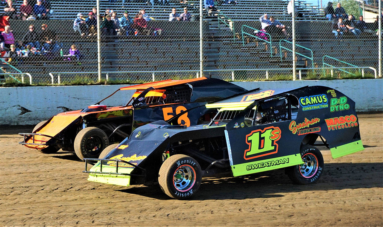 Tom Sweatman (11) battles for position with David Wolfard during the Modifieds feature race on Saturday at Grays Harbor Raceway in Elma. (Photo by AR Racing Videos)