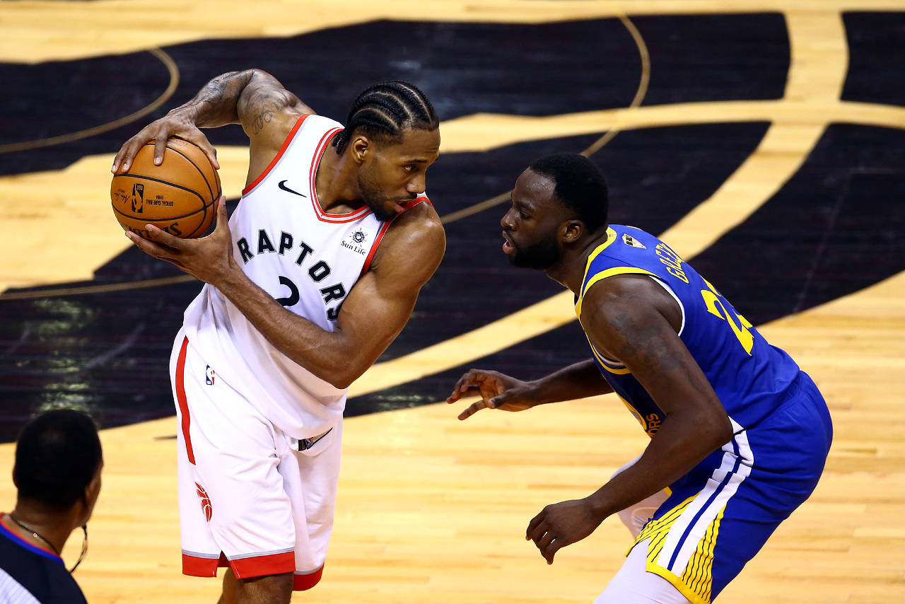 Vaughn Ridley | Getty Images/TNS                                Toronto’s Kawhi Leonard (2) is defended by Golden State’s Draymond Green in the second half during Game Five of the 2019 NBA Finals at Scotiabank Arena Monday in Toronto, Canada.