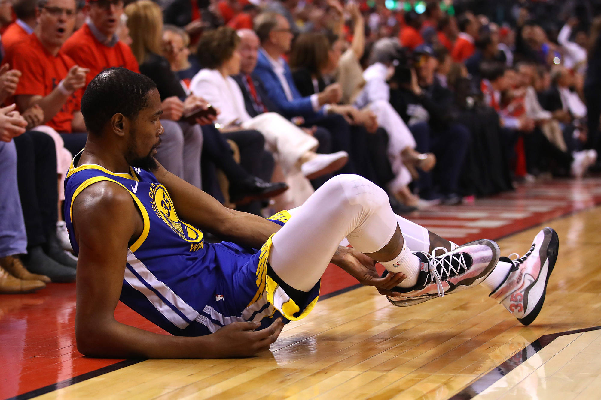 Gregory Shamus | Getty Images/TNS                                Golden State all-star forward Kevin Durant reacts after sustaining an injury Monday in the second quarter of Game Five of the 2019 NBA Finals against the Toronto Raptors at Scotiabank Arena in Toronto