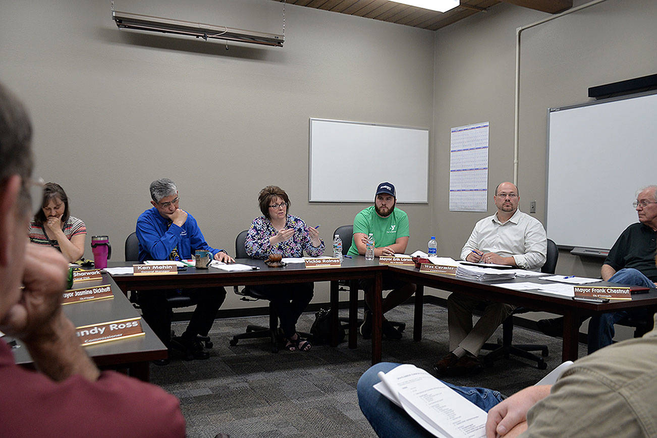 Louis Krauss | Grays Harbor News Group                                From left, Ken Mehin, Grays Harbor Transit’s general manager, sits next to County Commissioner Vickie Raines, Aberdeen Mayor Erik Larson, Commissioner Wes Cormier and Cosmopolis Mayor Frank Chestnut during a Transit board meeting Tuesday.