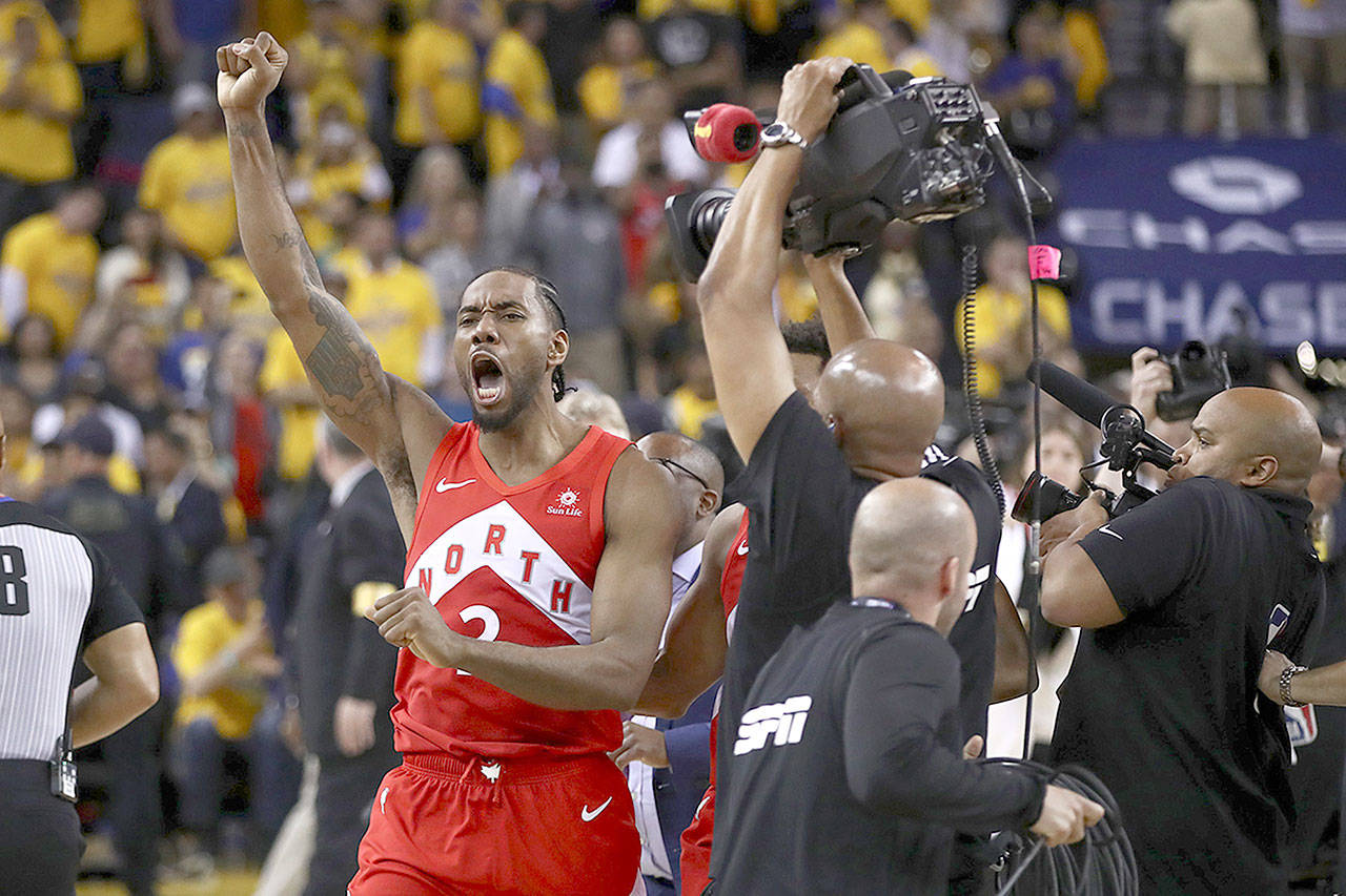 Kawhi Leonard of the Toronto Raptors celebrates his team’s 114-110 win against the Golden State Warriors in Game 6 to capture the NBA championship in Oakland, Calif., on Thursday. Leonard was named the Finals MVP (Ezra Shaw/Getty Images)