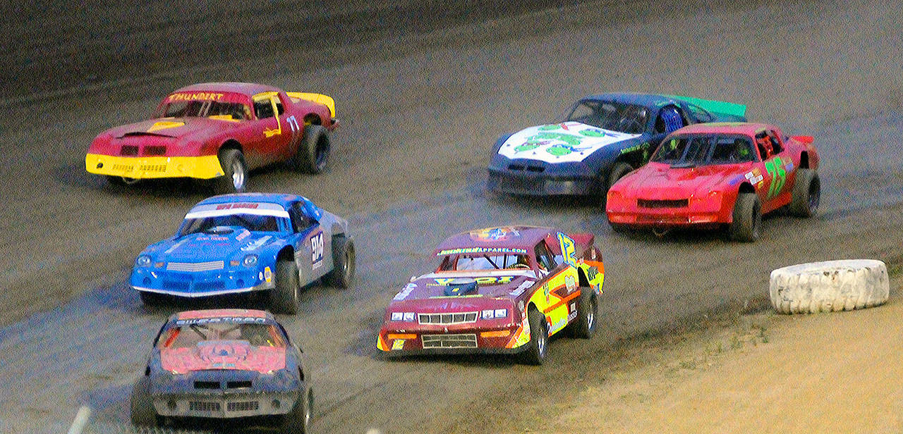 Zack Simpson (12) moves into the top five in the street stock finals on June 15 at Grays Harbor Raceway in Elma. (Hasani Grayson | Grays Harbor News Group)