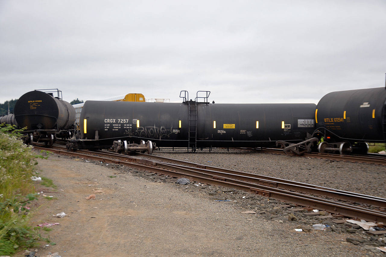 (Louis Krauss | Grays Harbor News Group) Three train cars derailed Saturday in Aberdeen near South Alder Street, with one car perpendicular to the tracks.