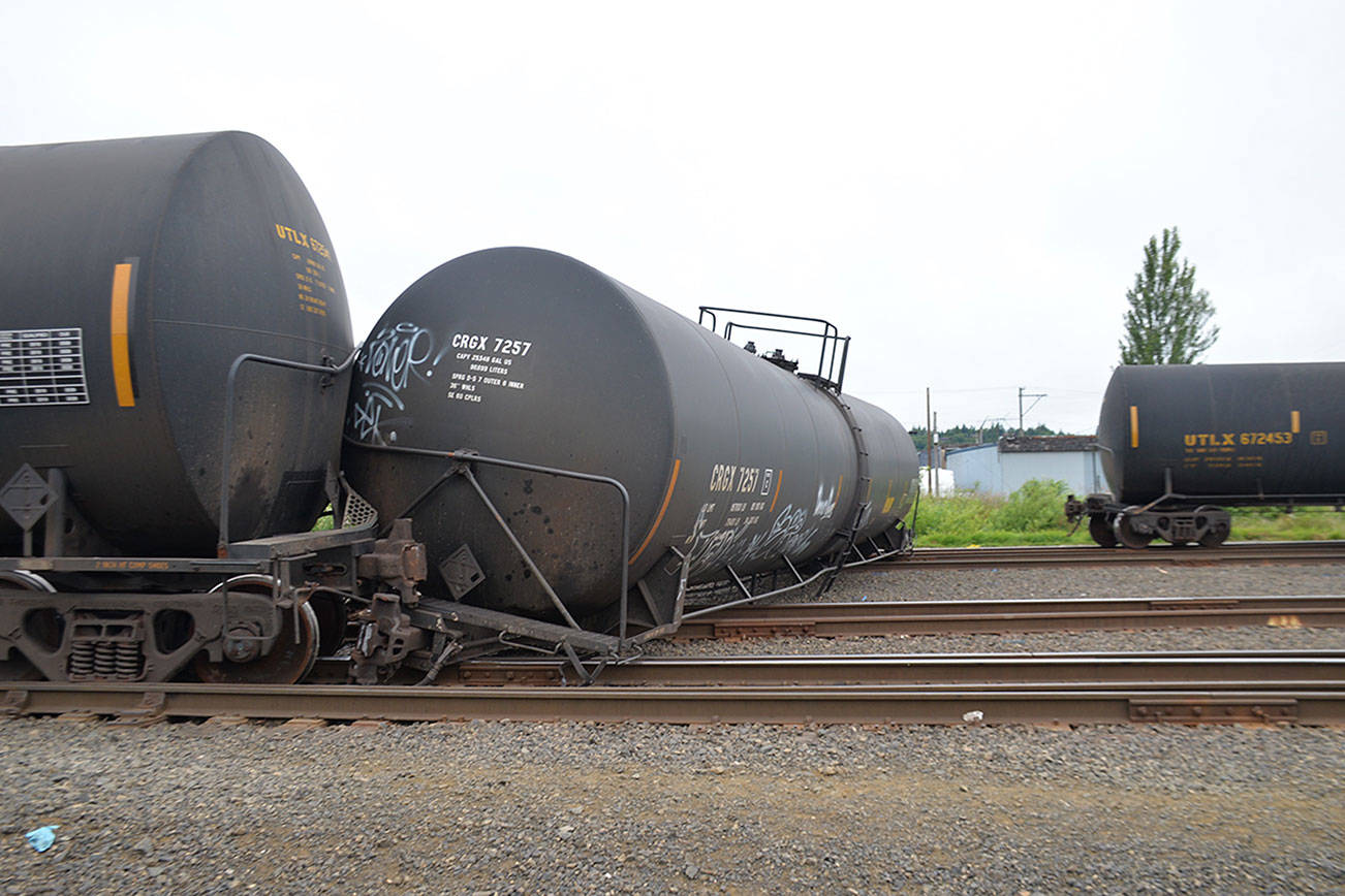 (Louis Krauss | Grays Harbor News Group) Three train cars derailed Saturday in Aberdeen near South Alder Street, with one car perpendicular to the tracks.