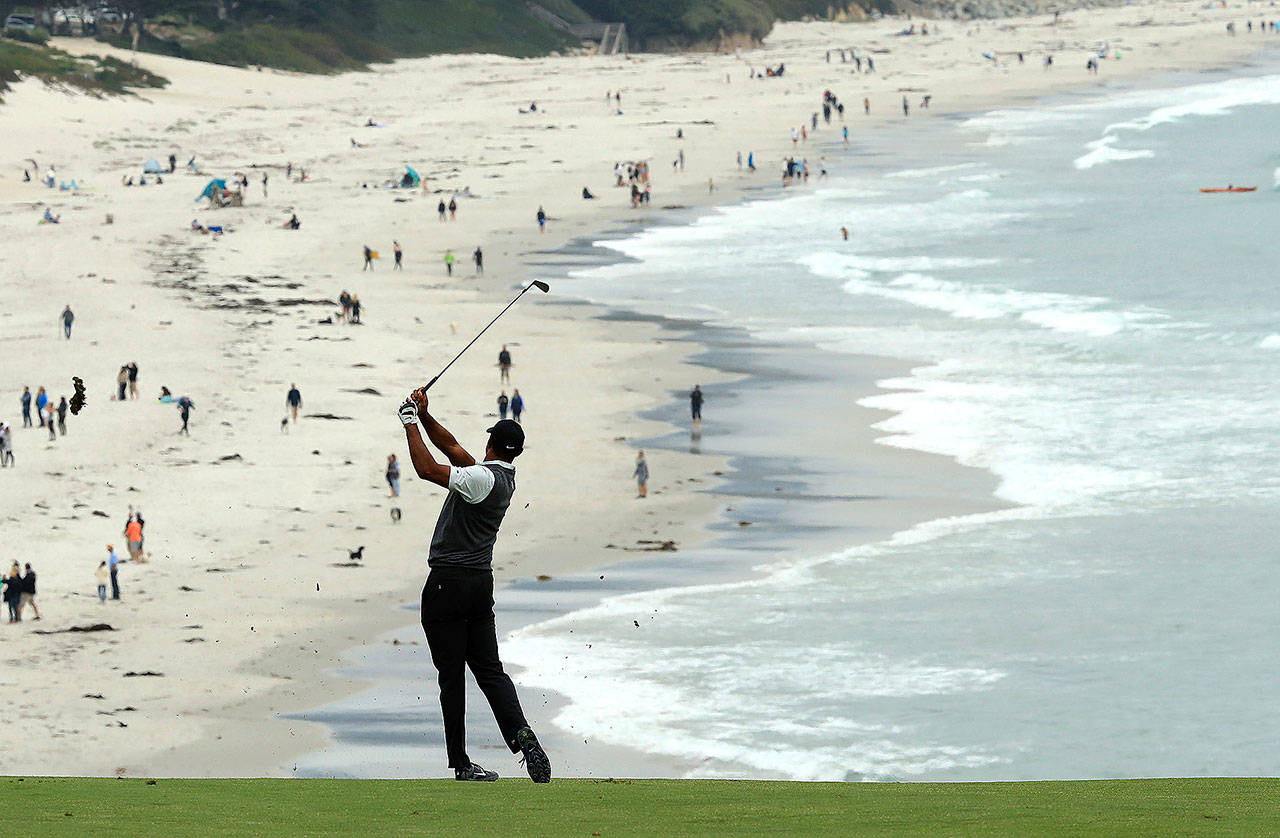 Tiger Woods plays the ninth hole at Pebble Beach Golf Links during last week’s first round of the U.S. Open. (Andrew Redington/Getty Images)