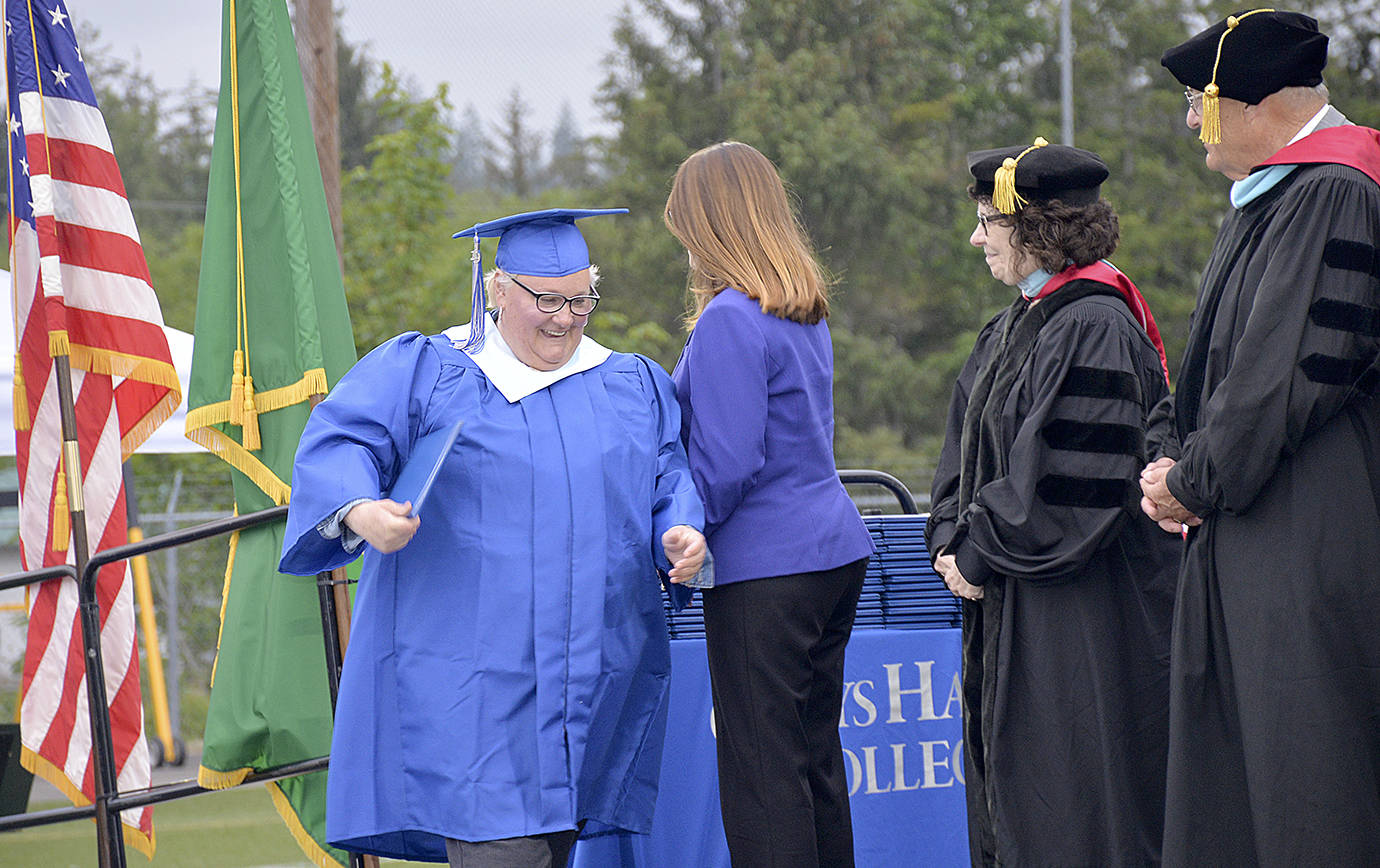 The first to cross the stage to get her diploma at the Grays Harbor College graduation ceremony Friday was part of the college’s first ever group of 21 to receive Bachelor in Applied Sciences degrees.