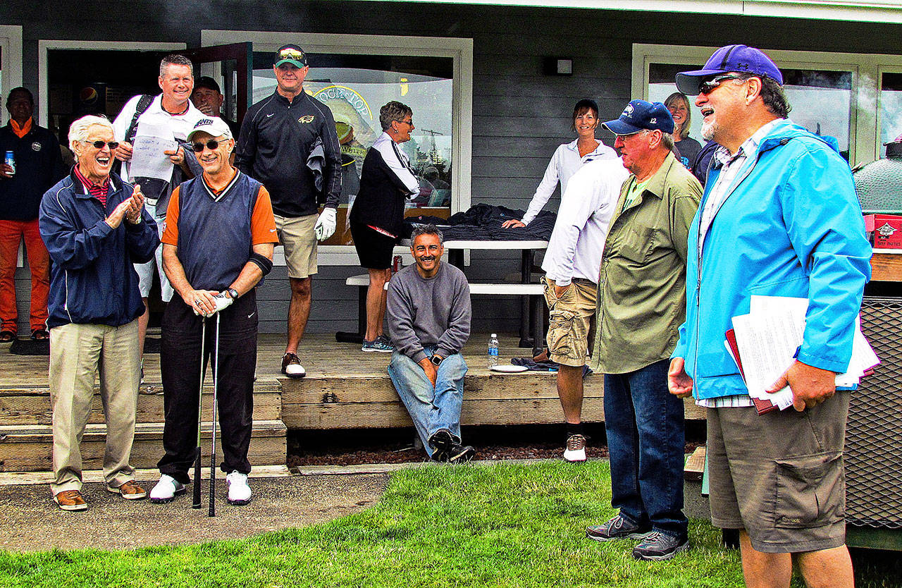 Former NFL coach and part-time Ocean Shores resident Dana LeDuc (far right) shares a laugh with fellow St. Louis Rams Super Bowl winning coaches Dick Vermeil and John Ramsdell (far left) and others at the 2017 Grays Harbor Youth Athletics benefit golf tournament. (North Coast News file photo)