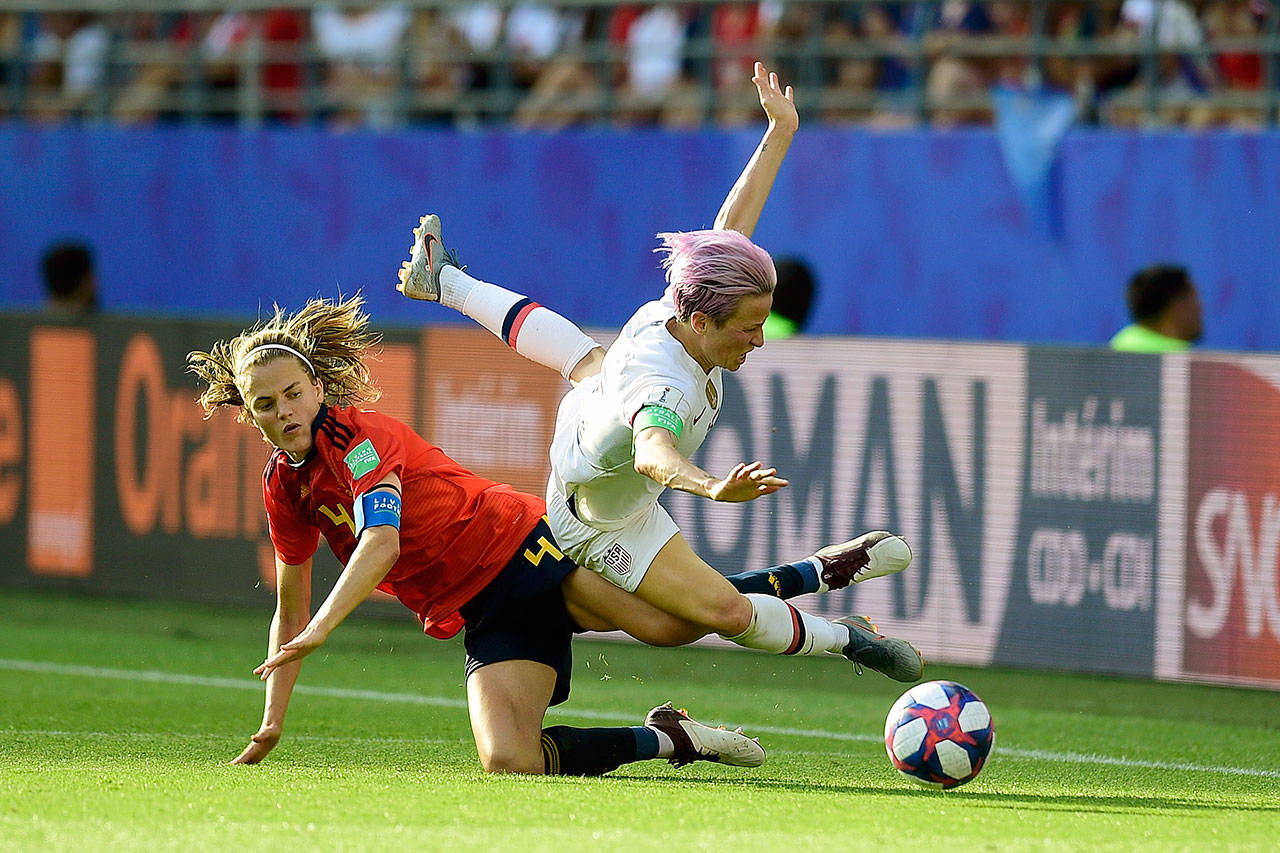 United States midfielder Megan Rapinoe, right, is fouled by Spain defender Irene Paredes during the second half of the USA’s 2-1 World Cup knockout-round victory over Spain on Monday. (Panoramic via ZUMA Press)