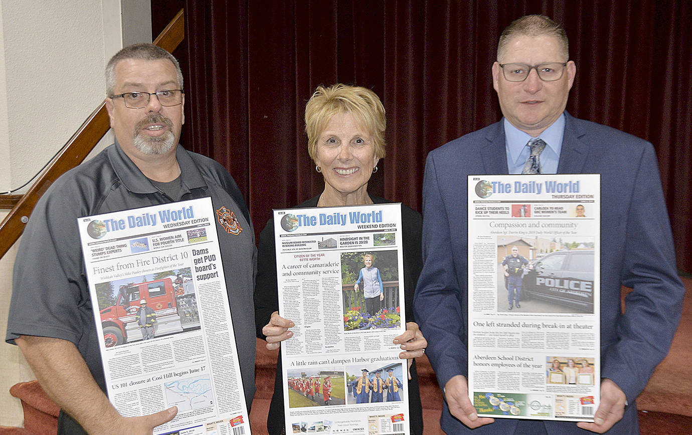 DAN HAMMOCK | GRAYS HARBOR NEWS GROUP                                Honorees at the Daily World 2019 Citizen of the Year banquet included, from left, Firefighter of the Year Mike Pauley, Citizen of the Year Bette Worth, and Police Officer of the Year Sgt. Darrin King.