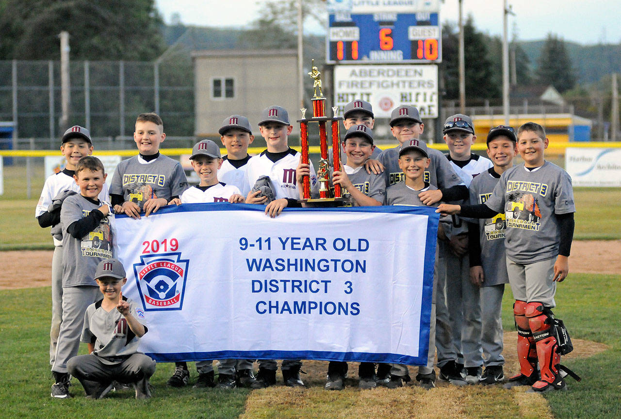 The Montesano Little League 9-11 year-old team poses for a photo after beating Chehalis to win the District 3 championship on Friday at Pioneer Park in Aberdeen. (Ryan Sparks | Grays Harbor News Group)