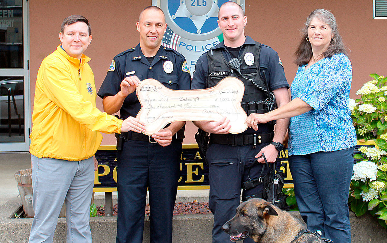 COURTESY CLARA GILLIES                                The Aberdeen Lions Club recently made a donation to the Aberdeen Police Department in support of K-9 Officer Ronin. The funds have been earmarked for training supplies and other needed equipment. Pictured from left are Lions Club President Aaron Gillies, Police Chief Steve Shumate, Officer Chad Pearsall with K-9 Officer Ronin, and Lion Kellie Dawson.