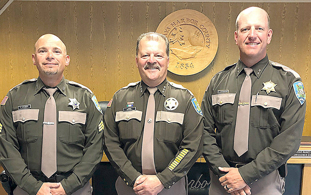 COURTESY GRAYS HARBOR COUNTY SHERIFF’S OFFICE                                Grays Harbor County Sheriff Rick Scott, center, promoted Brad Johansson, right, to undersheriff and Carson Steiner to sergeant on July 1.
