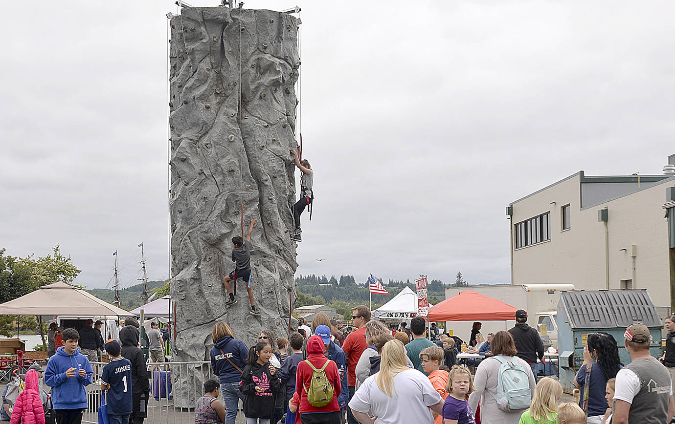 The rock climbing wall drew lines at Morrison Riverfront Park.