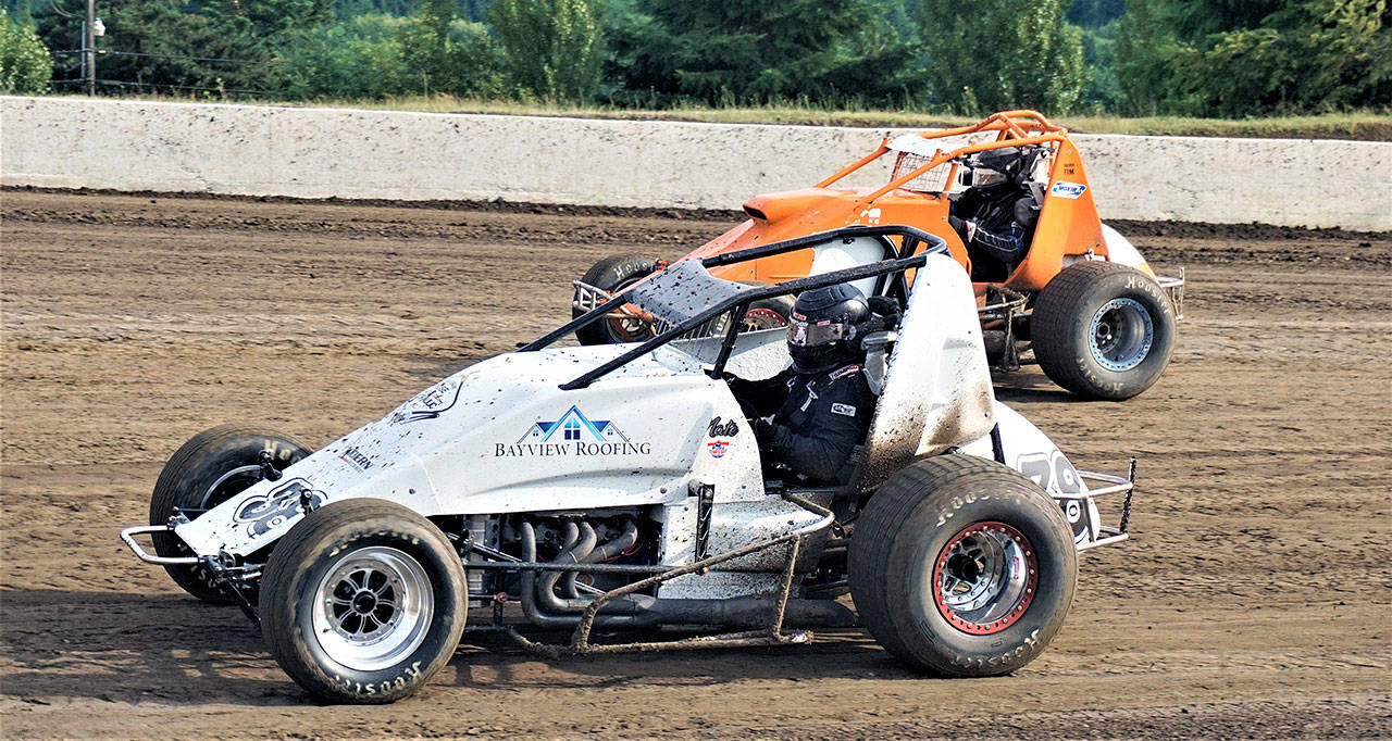 Nate Geister (38) and Tim Kennedy (26) race in the Wingless Sprint Cars series on Saturday at Grays Harbor Raceway. (Photo by AR Racing Videos)