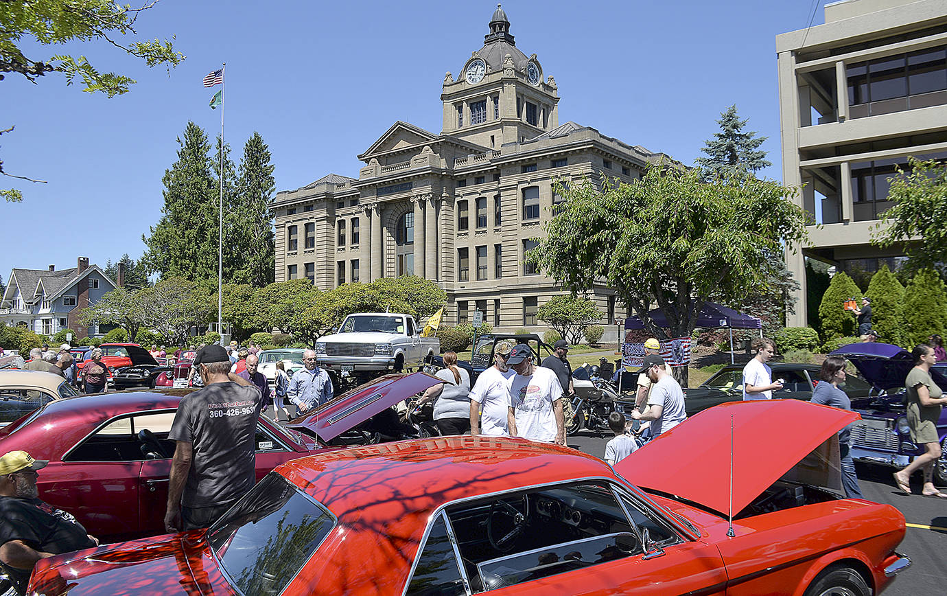 Photos by DAN HAMMOCK | GRAYS HARBOR NEWS GROUP                                There were 248 classic cars at the Historic Montesano Car Show Saturday. Here, some of the hundreds who caught the show walk along West Broadway in front of the County Courthouse.