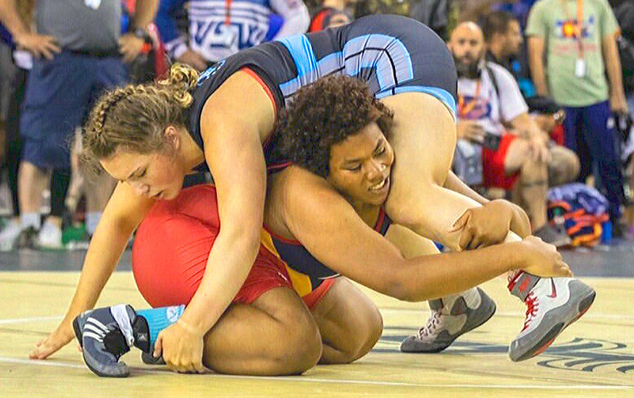Tatum Heikkila, top, battles for control during a match against Kayvette Osorio in the semi-finals of the consolation bracket at the USMC National Championships on July 19 in Fargo, North Dakota.