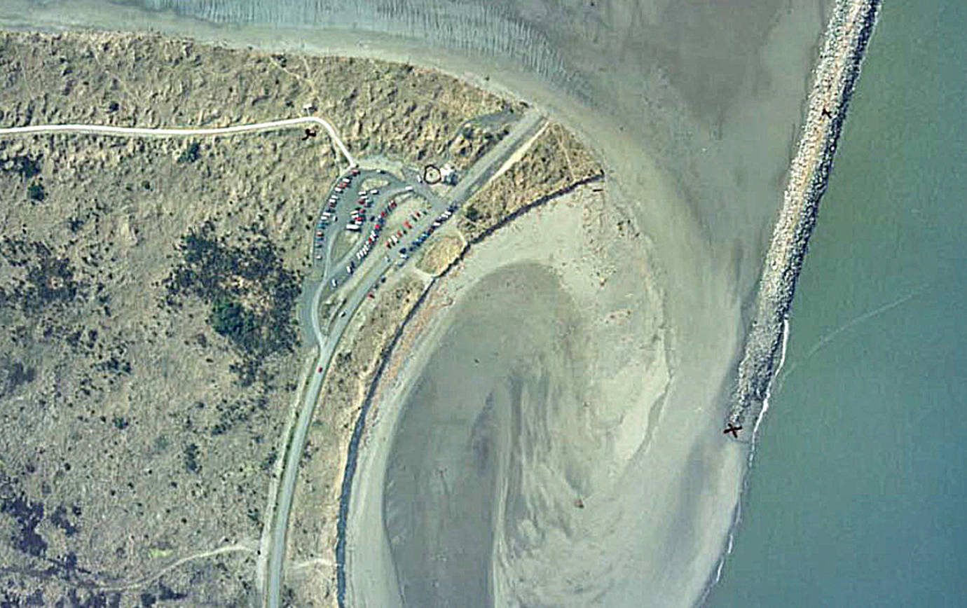 COURTESY ARMY CORPS OF ENGINEERS                                An aerial view taken after the sand spit connecting the South Jetty to the mainland was breached in 1993.