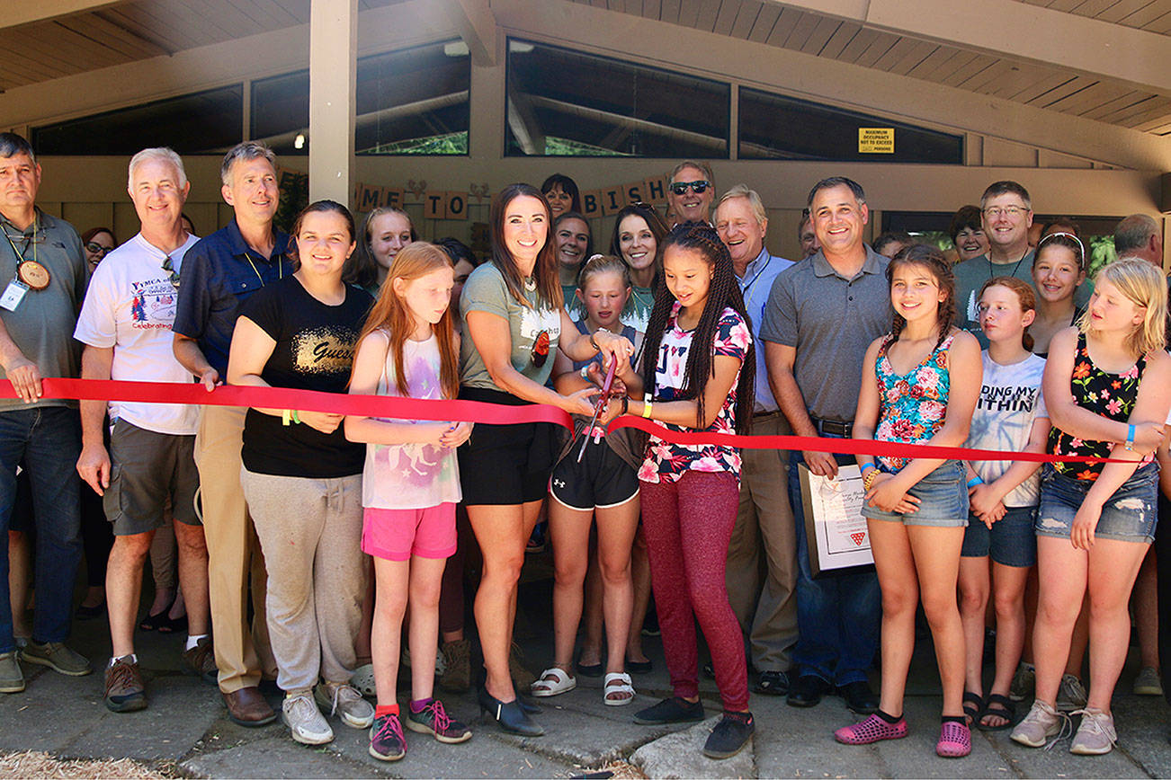 (Courtesy YMCA of Grays Harbor) Camp Bishop attendees cut a ribbon at the new dining hall.