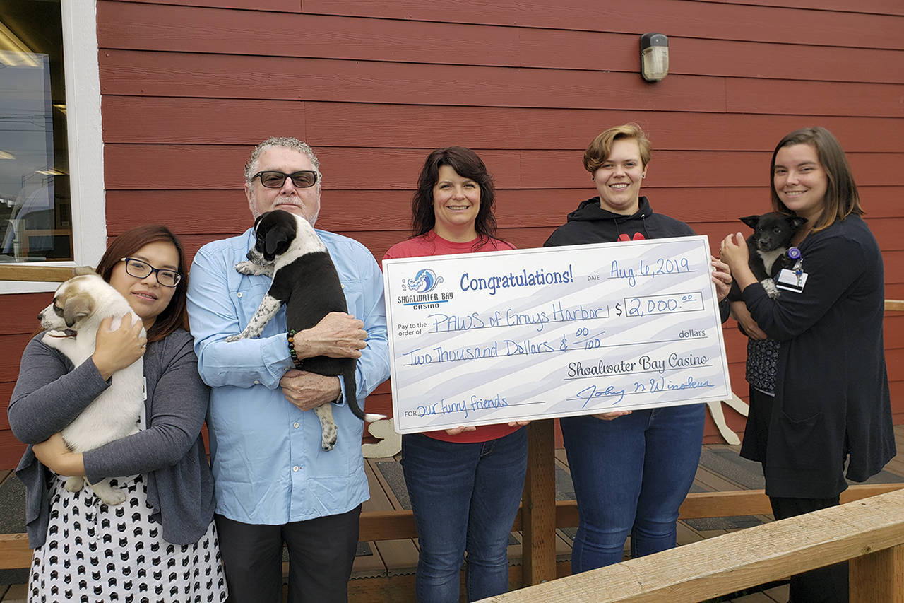 Photo by Todd Arend                                From left: Saengchanh Viengxay, casino marketing manager; Johnny Winokur, casino general manager and Willapa Bay Enterprises CEO; Tracie Kulich, PAWS animal services director; Dana Staab Erickson, PAWS executive director; and Tessa Davis, casino HR manager.
