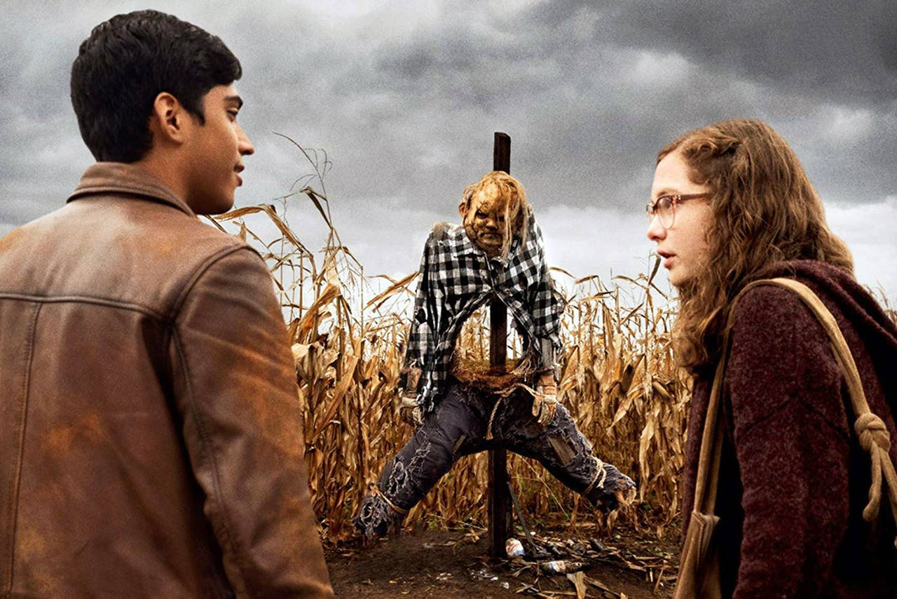 Lionsgate                                Ramon (Michael Garza) and Stella (Zoe Margaret Colletti) approach “Harold the Scarecrow” in “Scary Stories to Tell in the Dark.”