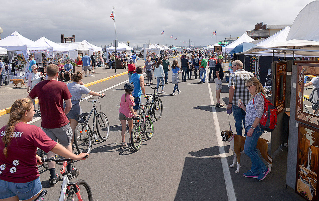 DAN HAMMOCK | GRAYS HARBOR NEWS GROUP                                Westhaven Drive at the Westport Marina was lined with vendor tents for the annual Westport Art Festival last weekend.