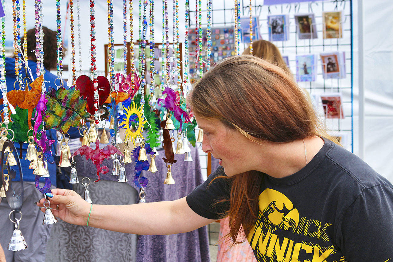 Amanda Rae checks out a few of the handmade wind chimes on display (Photos by Kris Cox/Lost River Photography)
