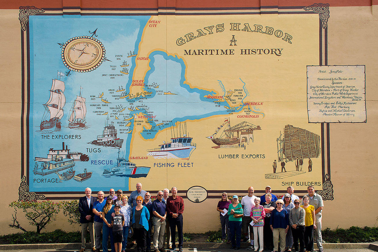Courtesy Robert Esposito                                Staff and administrators from the Port of Grays Harbor, the City of Aberdeen and Our Aberdeen stand next to a new mural in Aberdeen that was dedicated Tuesday to the late Port Commissioner Jack Thompson. The mural was designed and painted by Jenny Fisher.
