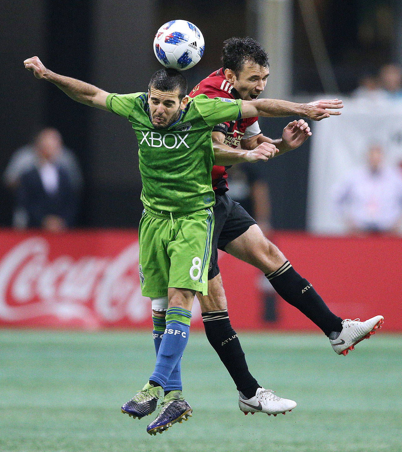 Seattle Sounders midfielder Victor Rodriguez and Atlanta United defender Michael Parkhurst collide on a header during the second half on Sunday, July 15, 2018, in Atlanta, Ga. (Curtis Compton/Atlanta Journal-Constitution/TNS)