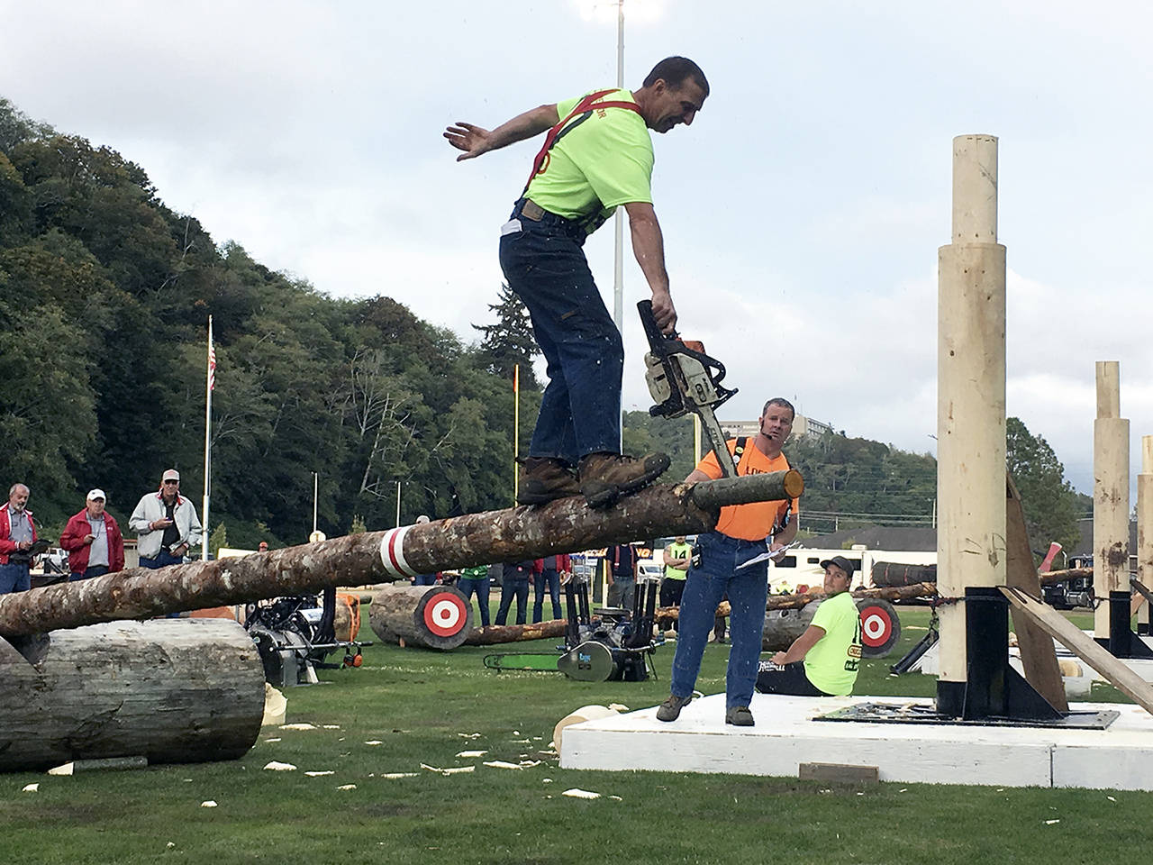 Kat Bryant | Grays Harbor News Group                                Paul Pendergraft balances on the obstacle pole during the 2018 Playday as emcee Don Bell looks on.