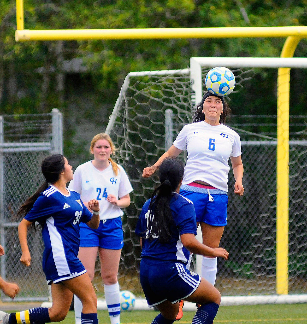Grays Harbor’s Kayla Delahanty gets her head on the ball to clear it away from the 18-yard box at in the Choker’s friendly match against Portland on Wednesday at Stewart Field. (Hasani Grayson | Grays Harbor News Group)