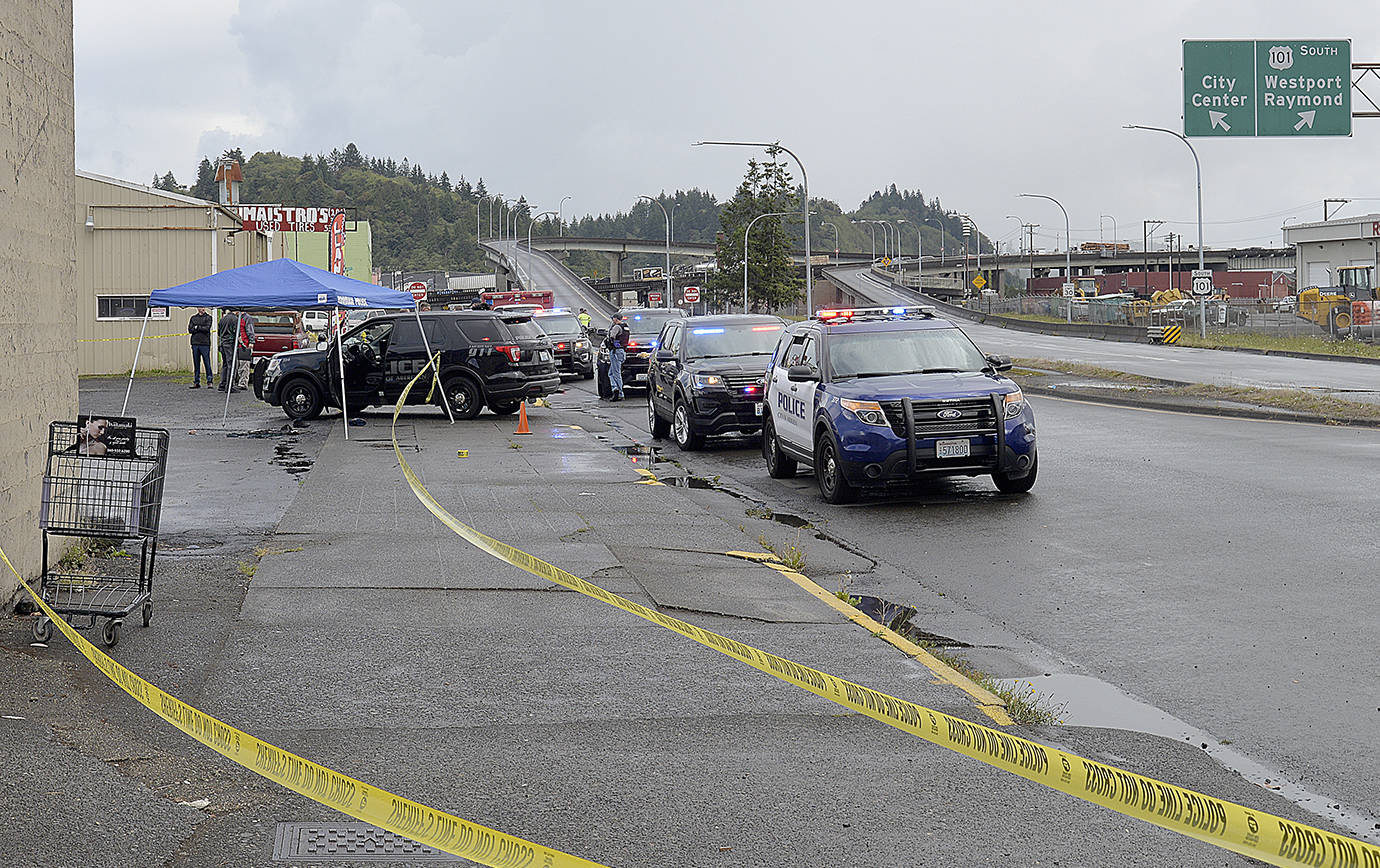 DAN HAMMOCK | GRAYS HARBOR NEWS GROUP                                Multiple agencies investigate an officer-involved shooting on West State Street near the Chehalis River Bridge on-ramp early Monday afternoon.