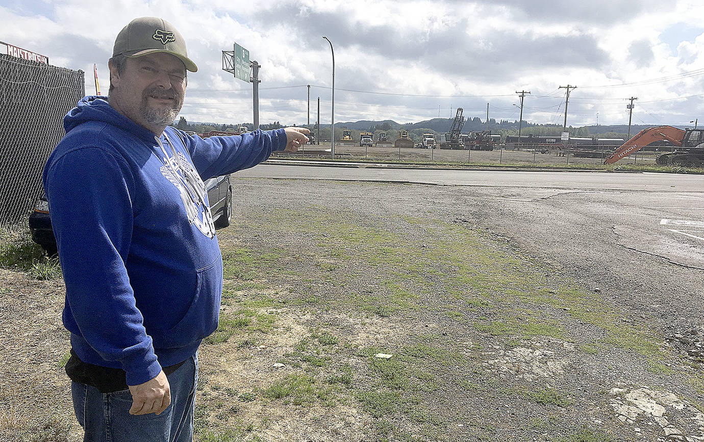 Photo by DAN HAMMOCK | GRAYS HARBOR NEWS GROUP                                Phil Calloway, Executive Director of Revival Grays Harbor, stands in the lot where Kristopher D. Fitzpatrick of Aberdeen was shot by Aberdeen Police midday Monday.