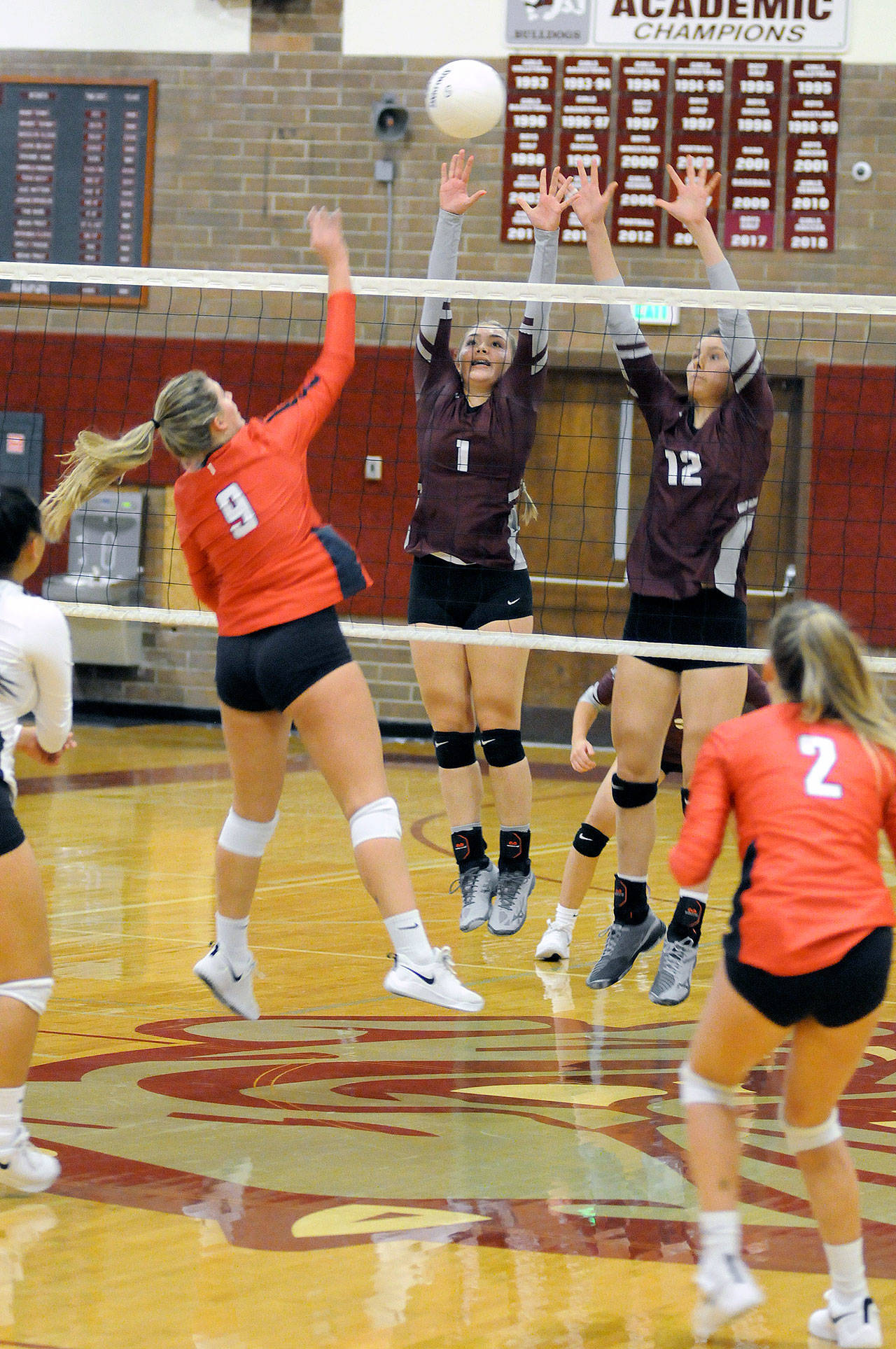 Montesano’s Janessa Otterstetter (1) and McKynnlie Dalan (12) defend a drop shot from King’s Way Christian’s Abby Cummins (9) during a match on Monday at Montesano High School. (Ryan Sparks | Grays Harbor News Group)