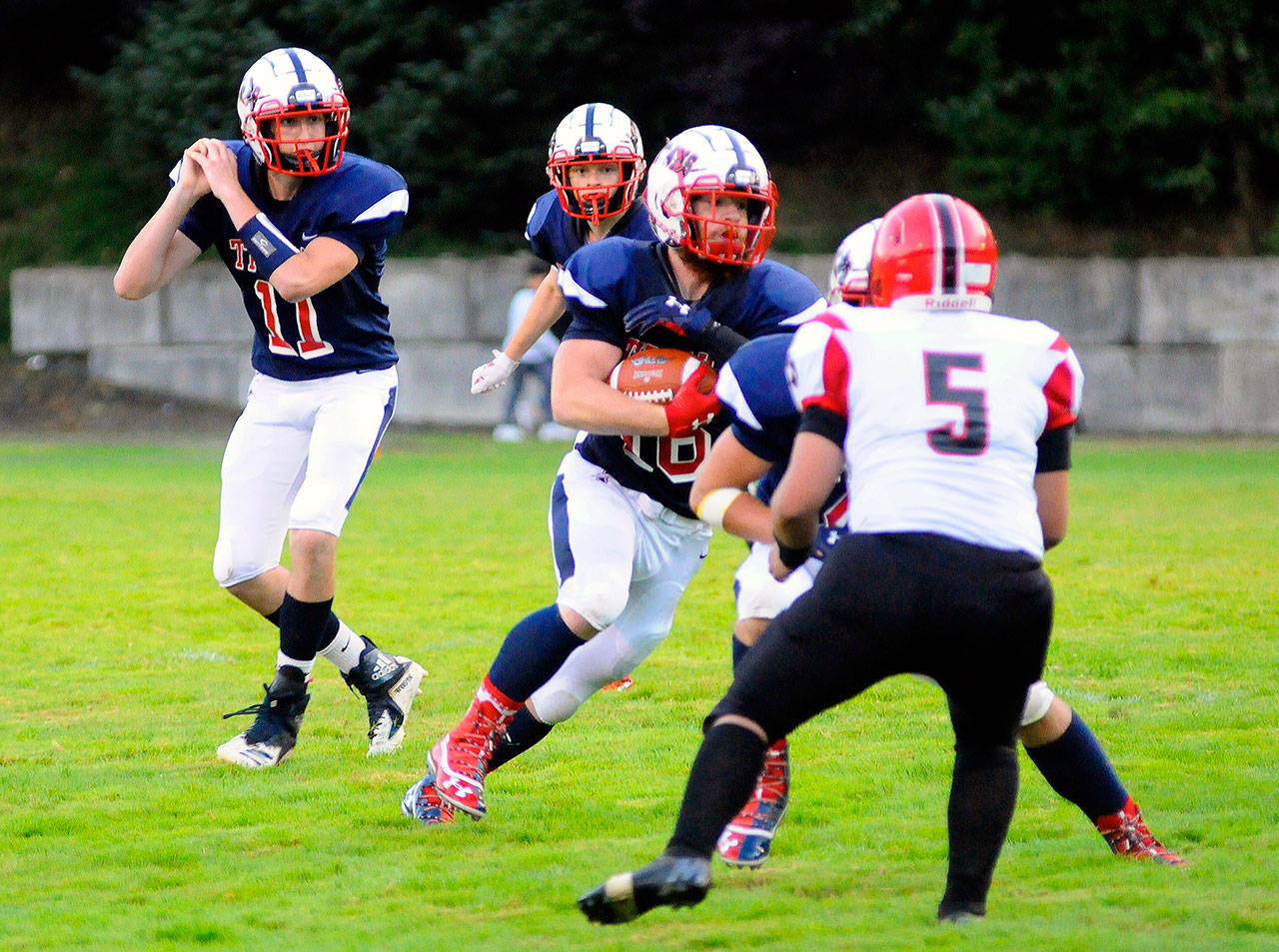 Pe Ell-Willapa Valley running back Max Smith breaks toward the open field in the first quarter against Raymond. Smith had four rushing touchdowns and 154 yards on the ground in the Titan’s 49-0 victory. (Hasani Grayson | Grays Harbor News Group)