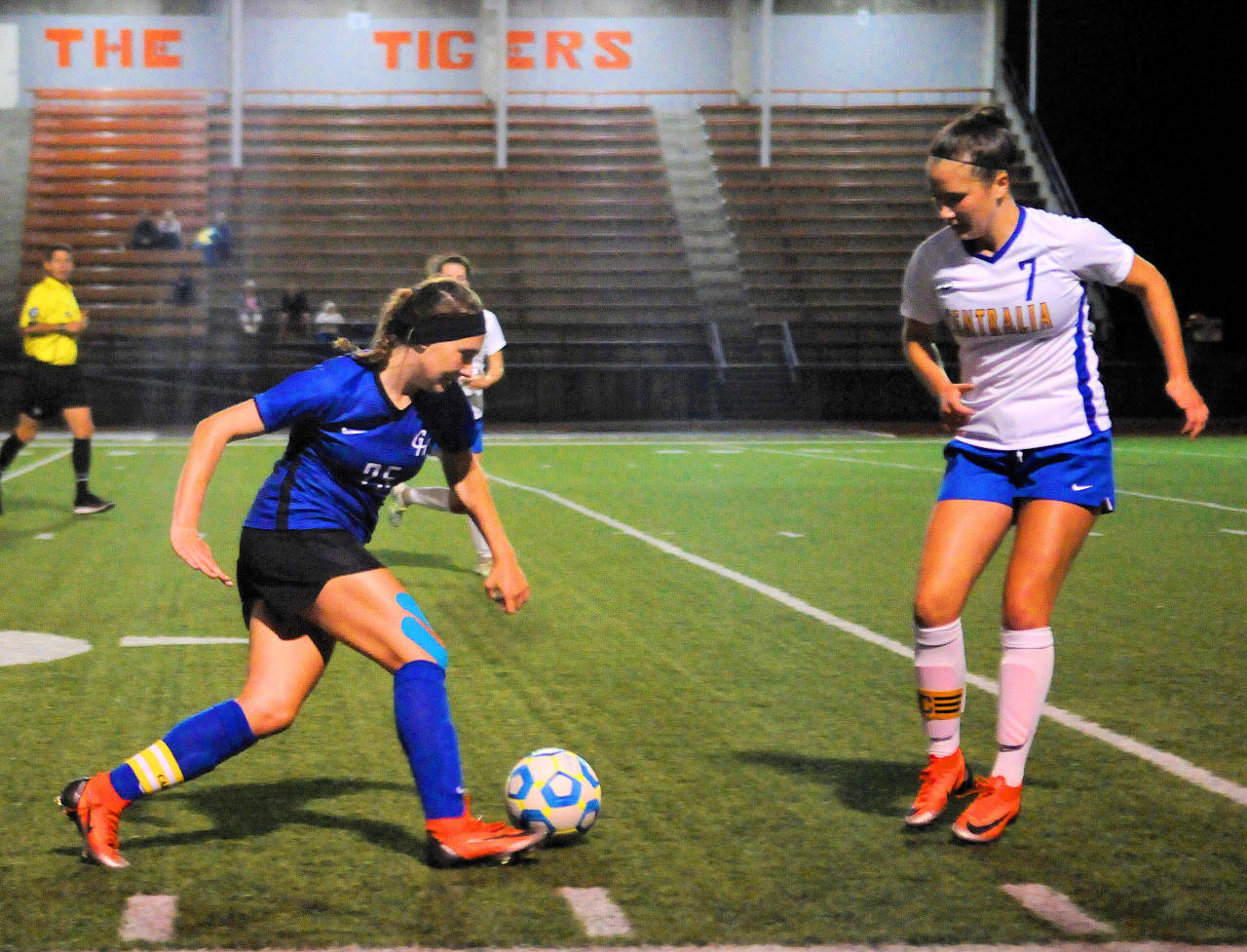 Grays Harbor’s Lexi Sapegin, left, tries to dribble past Centralia’s Gabbi Nowodworski in the second half of a match on Saturday in Centralia. (Hasani Grayson | Grays Harbor News Group)
