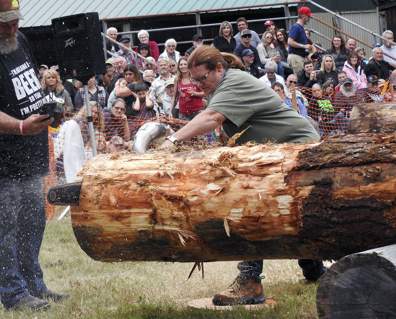 photos by Kat Bryant | Grays Harbor News Group                                Melani Keel took third place in a field of 16 men and women in chainsaw bucking.