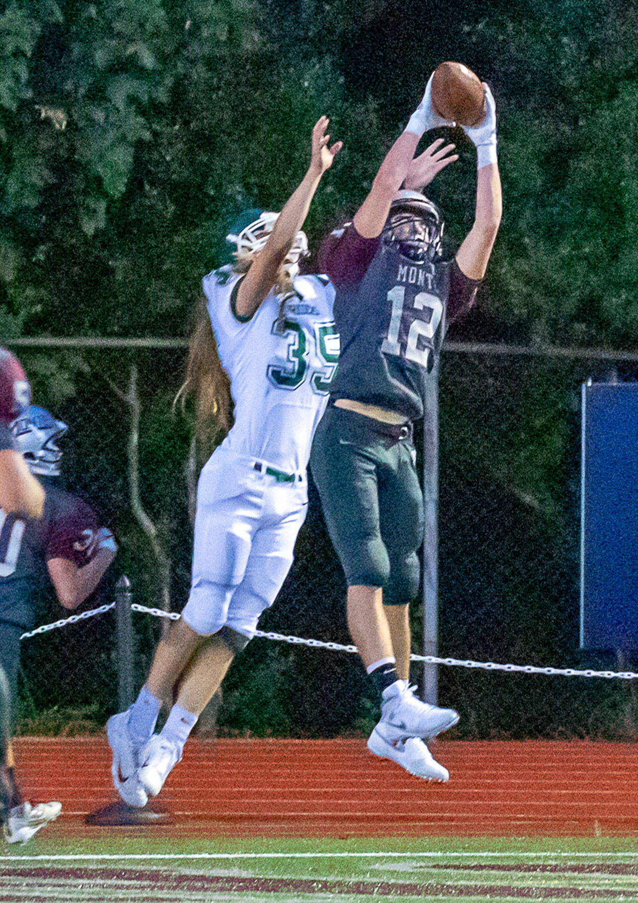 Montesano’s Sam Winter (12) intercepts a pass against Port Angeles recevier Derek Bowechop during the Bulldogs’ 70-12 rout of the Roughriders on Friday at Jack Rottle Field in Montesano. (Hasani Grayson | Grays Harbor News Group)
