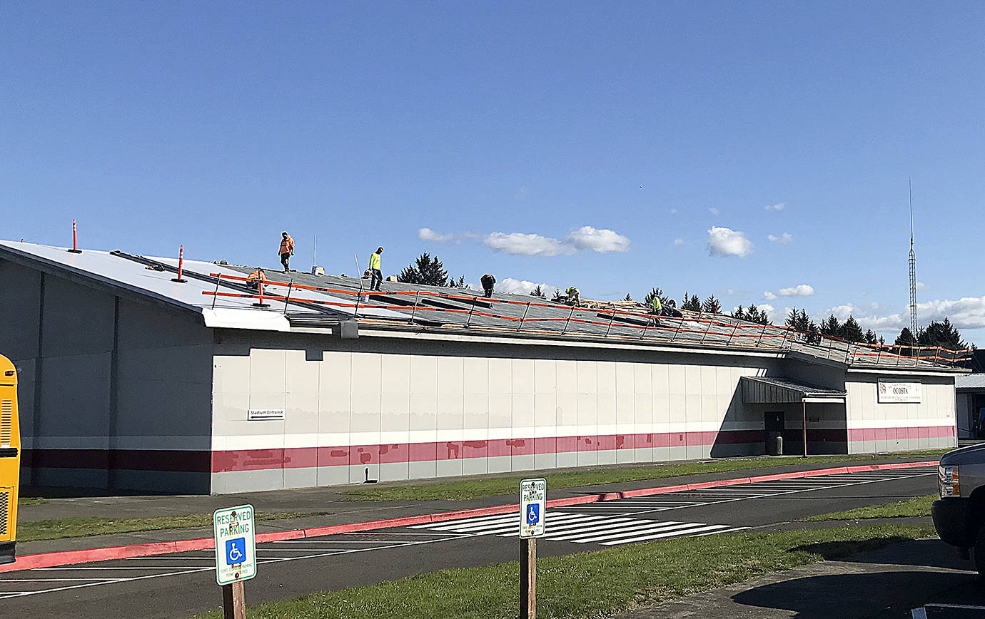 COURTESY OCOSTA SCHOOL DISTRICT                                The Ocosta School District is putting a new roof on the community gym. Construction began Sept. 16 and continued Monday.